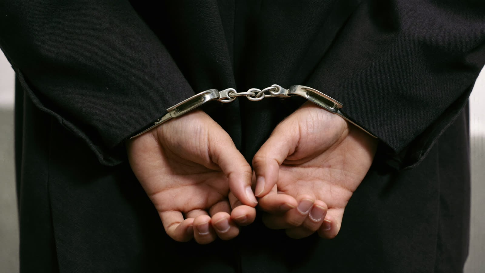 Hands in handcuffs