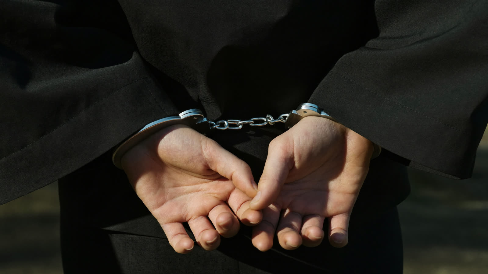 Hands in handcuffs